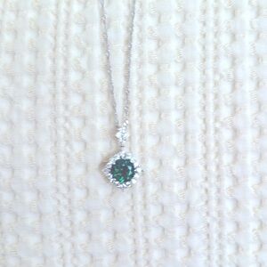 Green and silver pendant.